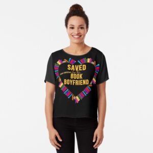 Woman wearing t-shirt that says "Saved (from boredom) by the book boyfriend.